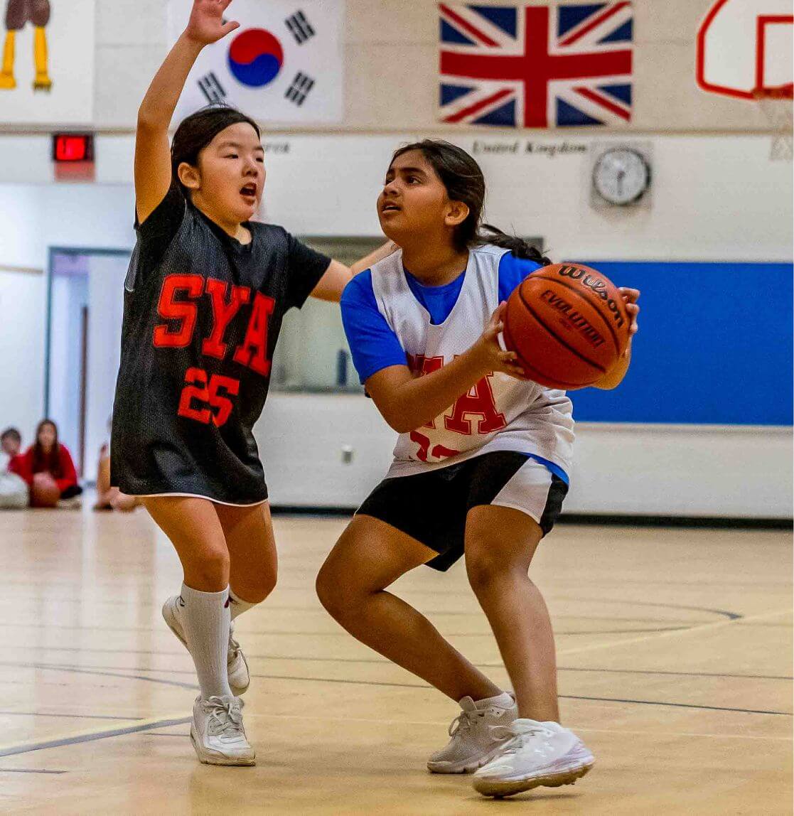 SYA girls playing basketball