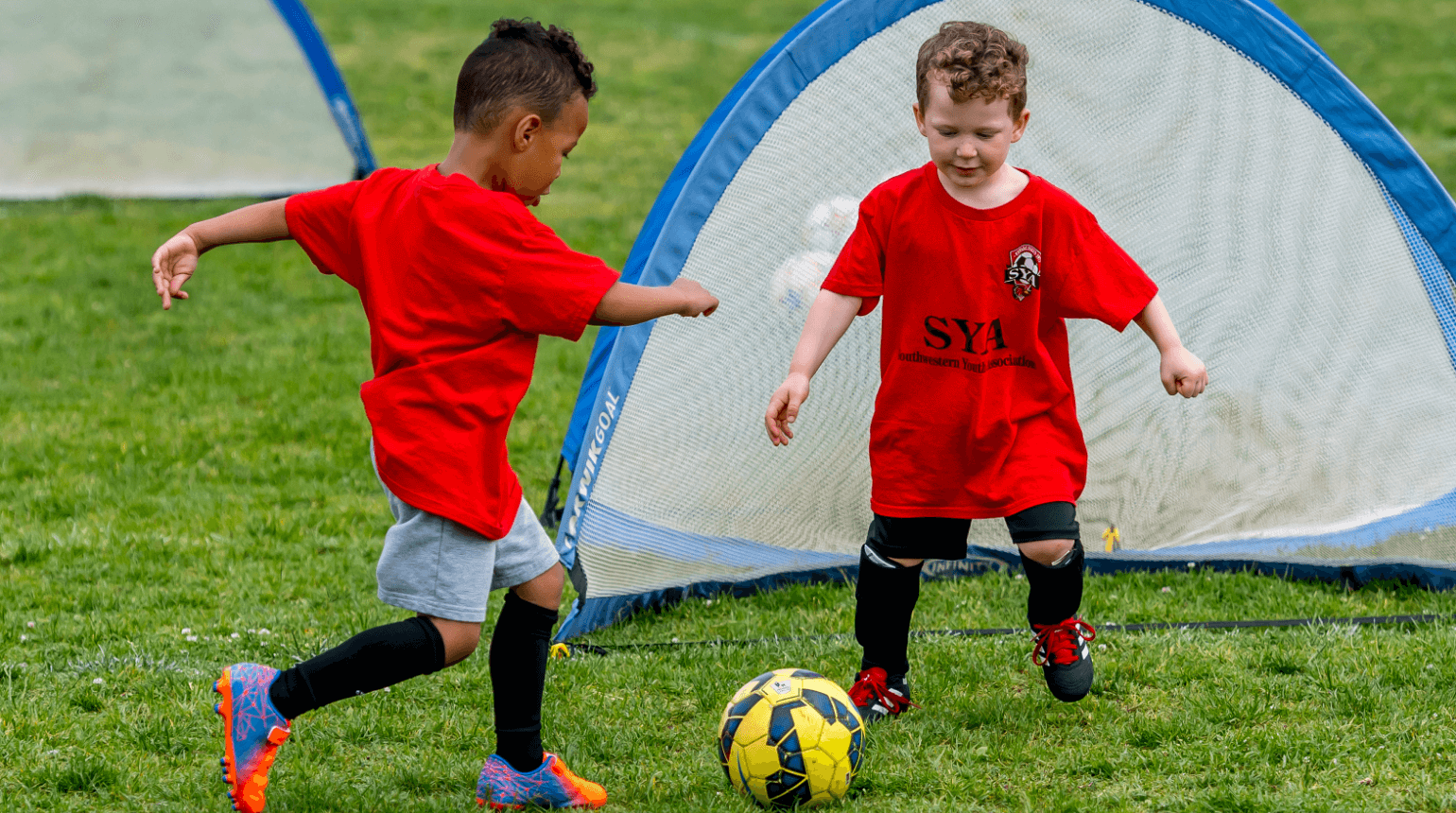 SYA Recreational Soccer player shooting a ball on goal