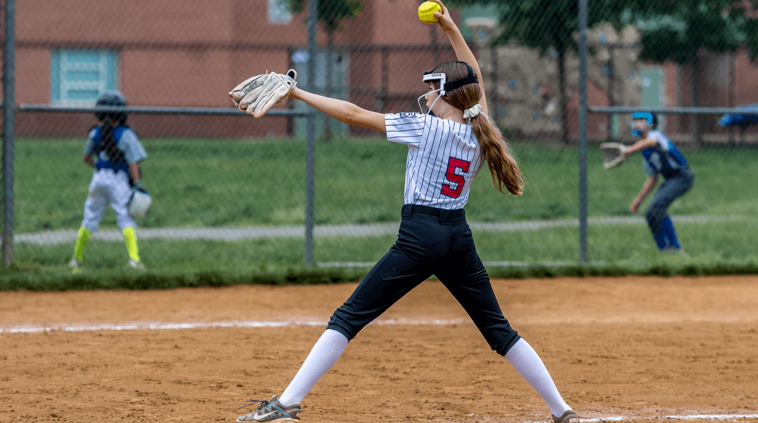 SYA Softball pitcher throwing a ball