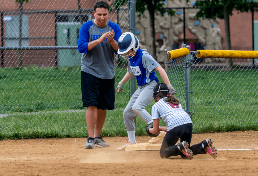 SYA Softball Volunteer with players