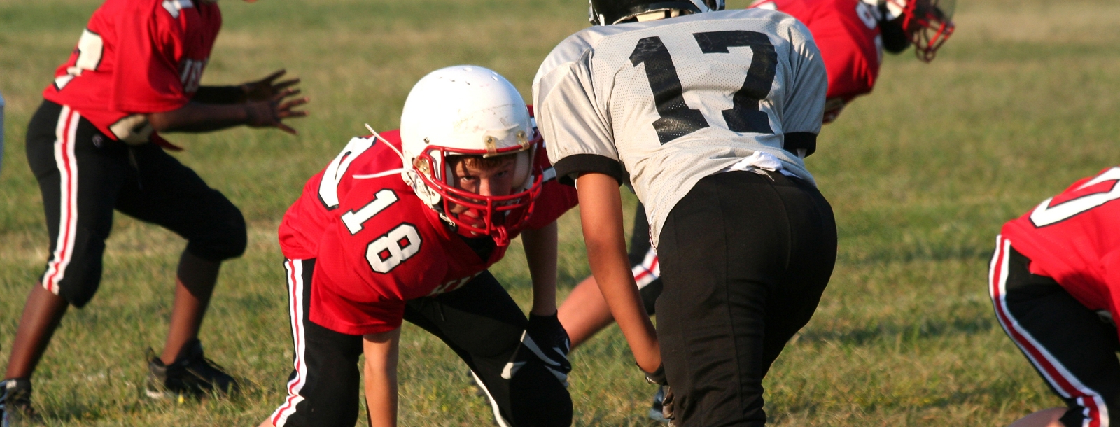 SYA tackle football players on the field