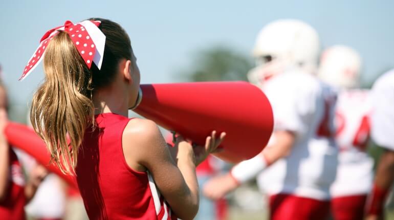 cheerleaders and football players