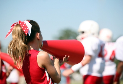 cheerleaders and football players