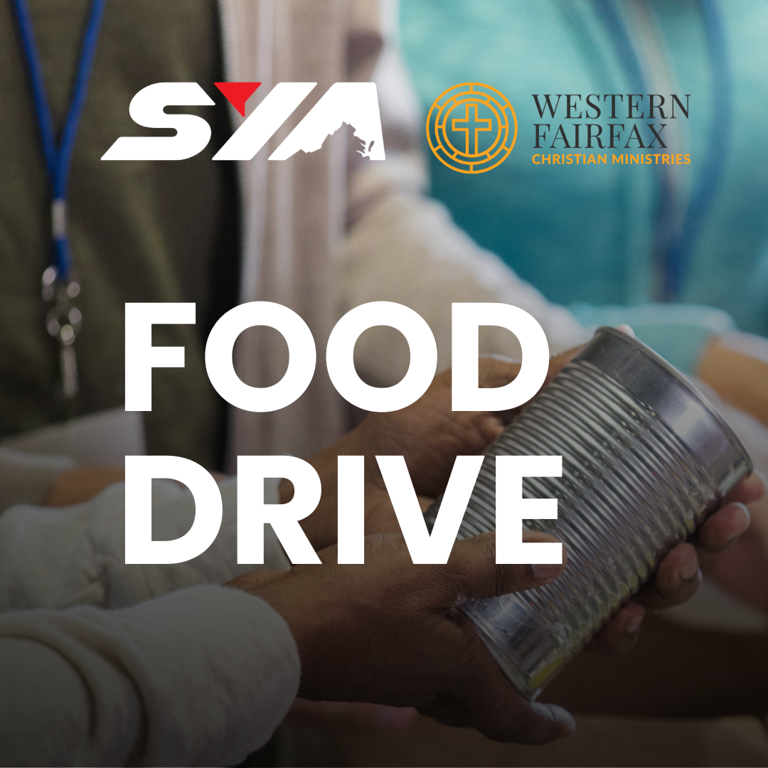 person handing a can to another for a food drive